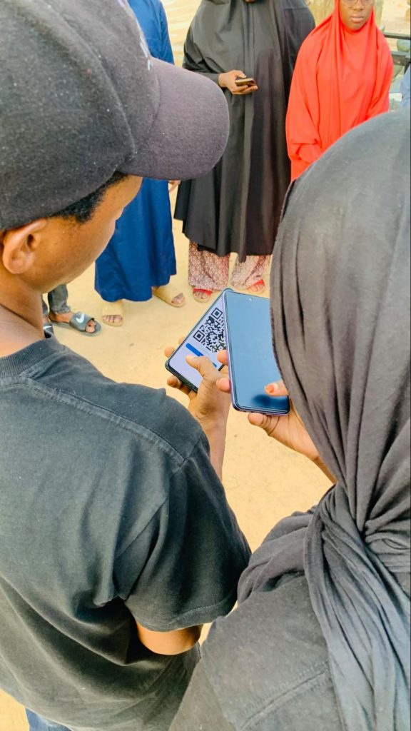 Image of our community member scanning to perform cycle.